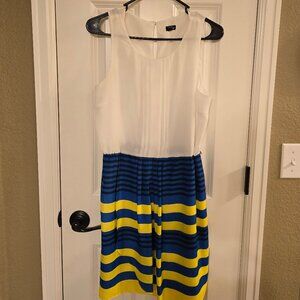 Womens sleevless dress with blue and yellow skirt. Approx size 6 US